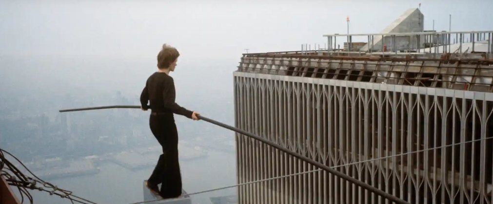 Philippe Petit walking the wire between towers